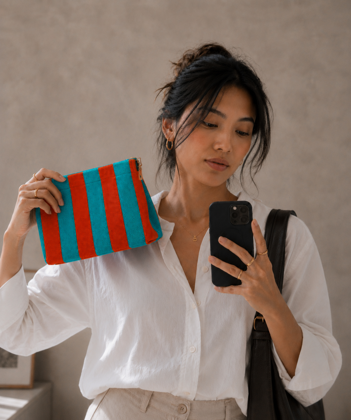 Woman holding a Better Lemonade striped pouch